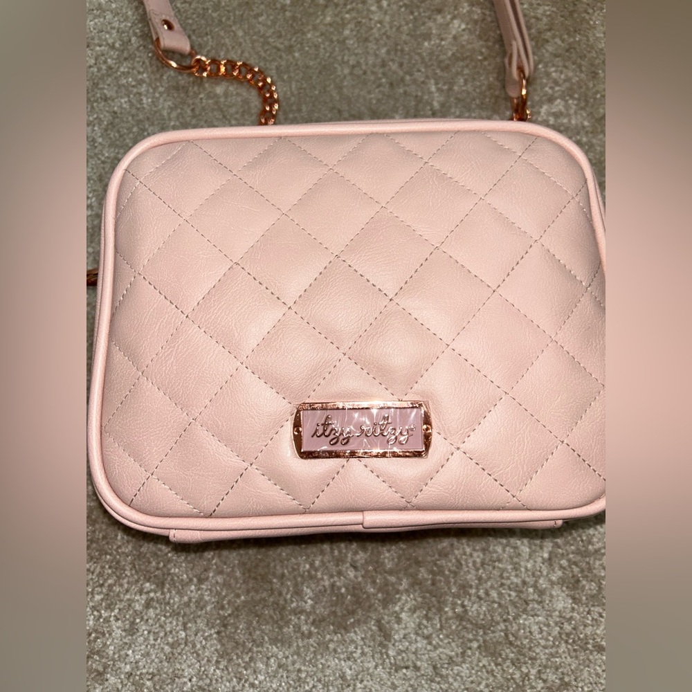Itzy Ritzy pink diaper bag with changing pad